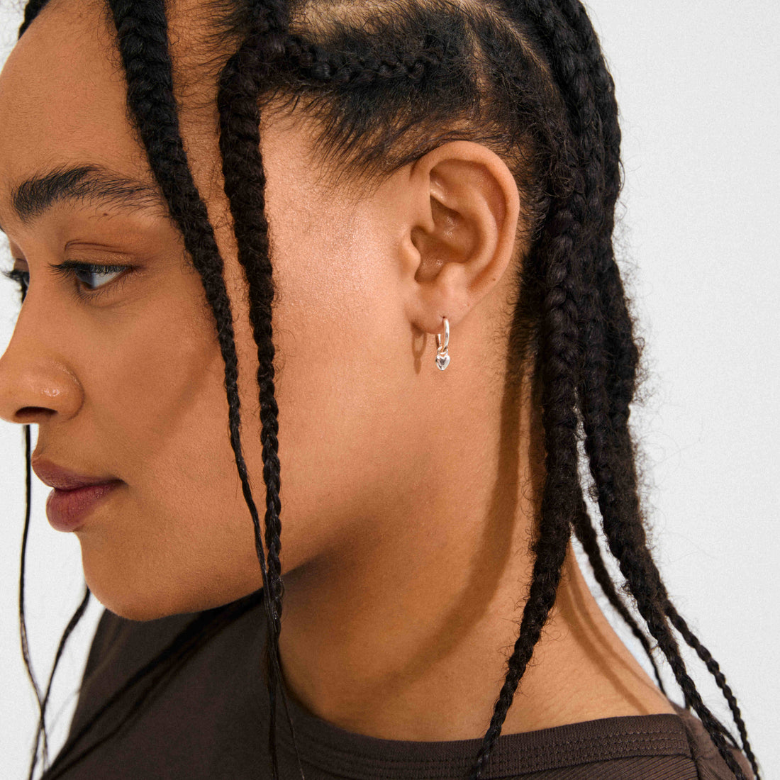 ALAIA recycled tiny heart pendant earrings