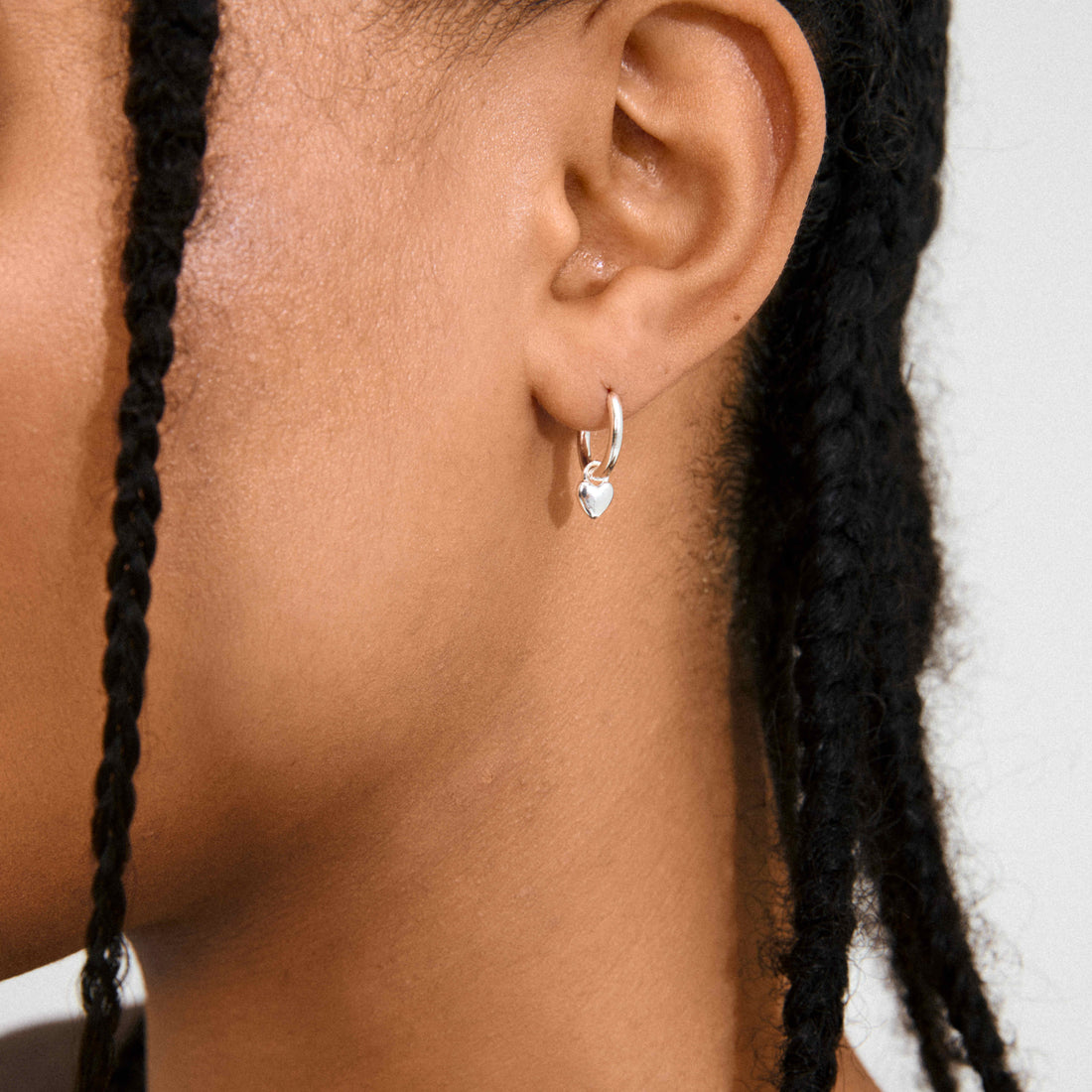 ALAIA recycled tiny heart pendant earrings